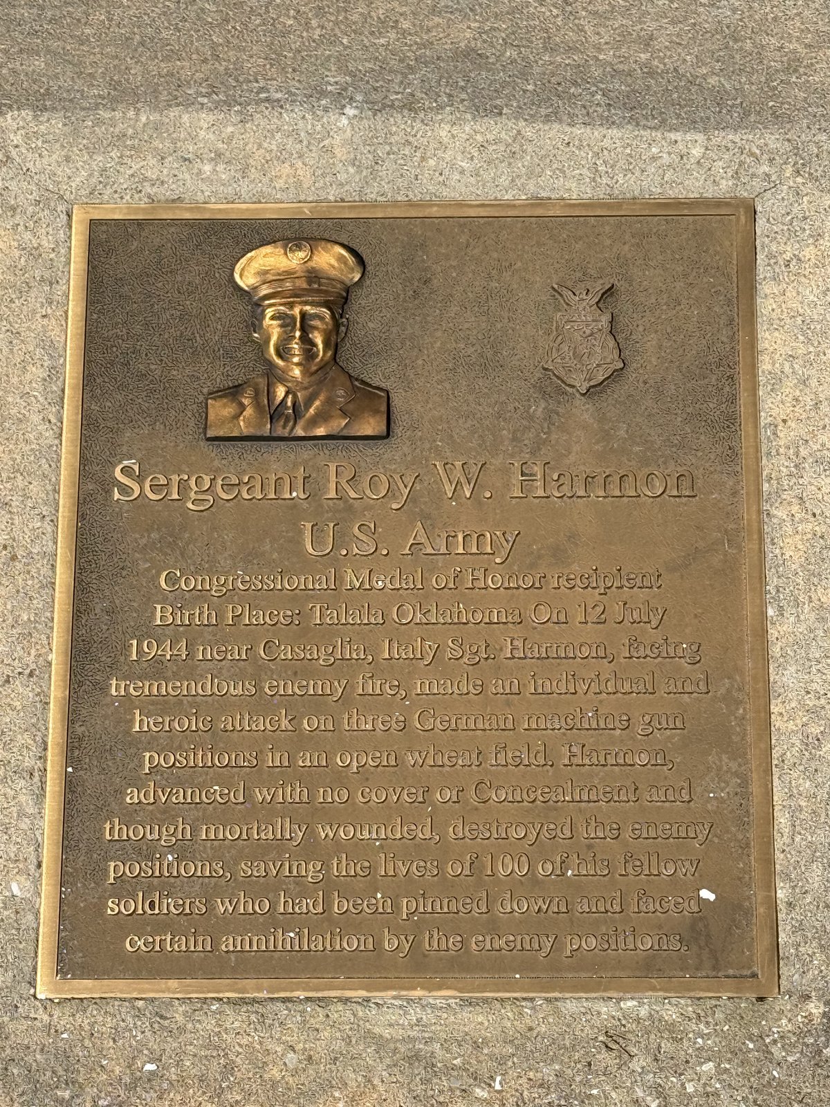 Bronze memorial plaque with a relief portrait of Sergeant Roy W. Harmon and the Medal of Honor