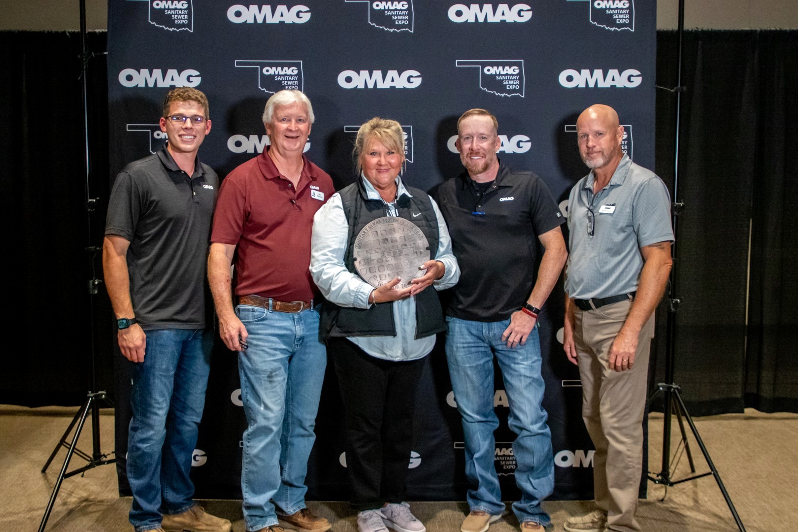 Mayor Kandy Damron accepting the OMAG 2023 Sanitary Sewer System of the Year award for the Town of Talala
